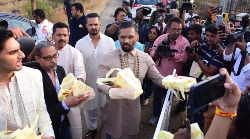Bollywood actor Sunil Shetty distributed boxes of sweets to the wedding guests of his daughter